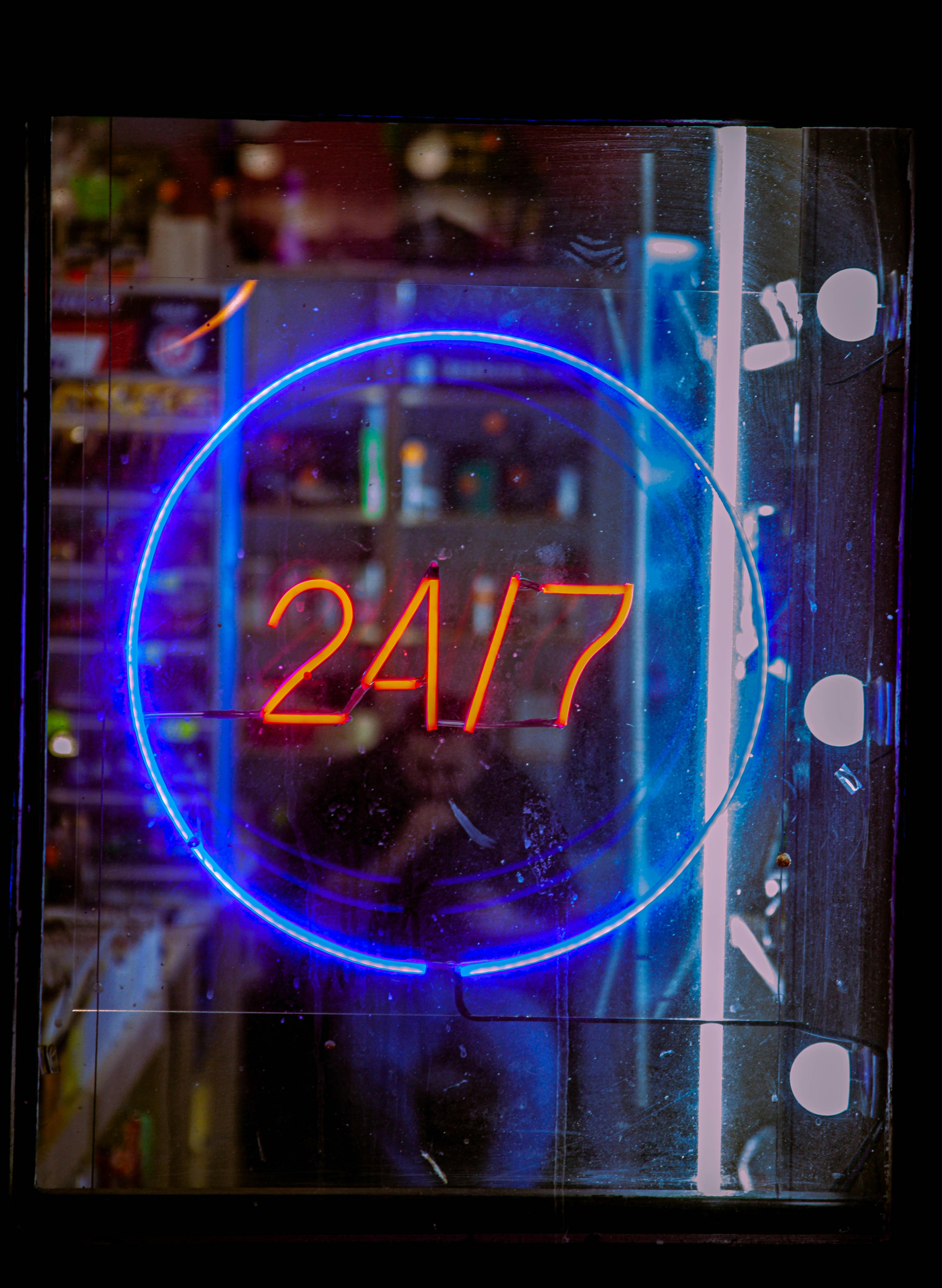 24/7 customer support neon sign for digital services.